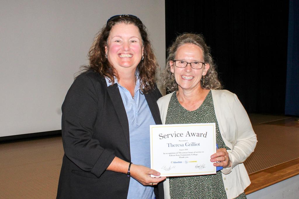 Theresa Grilliot receives a gift for reaching 750 service hours in her career at Edison State
