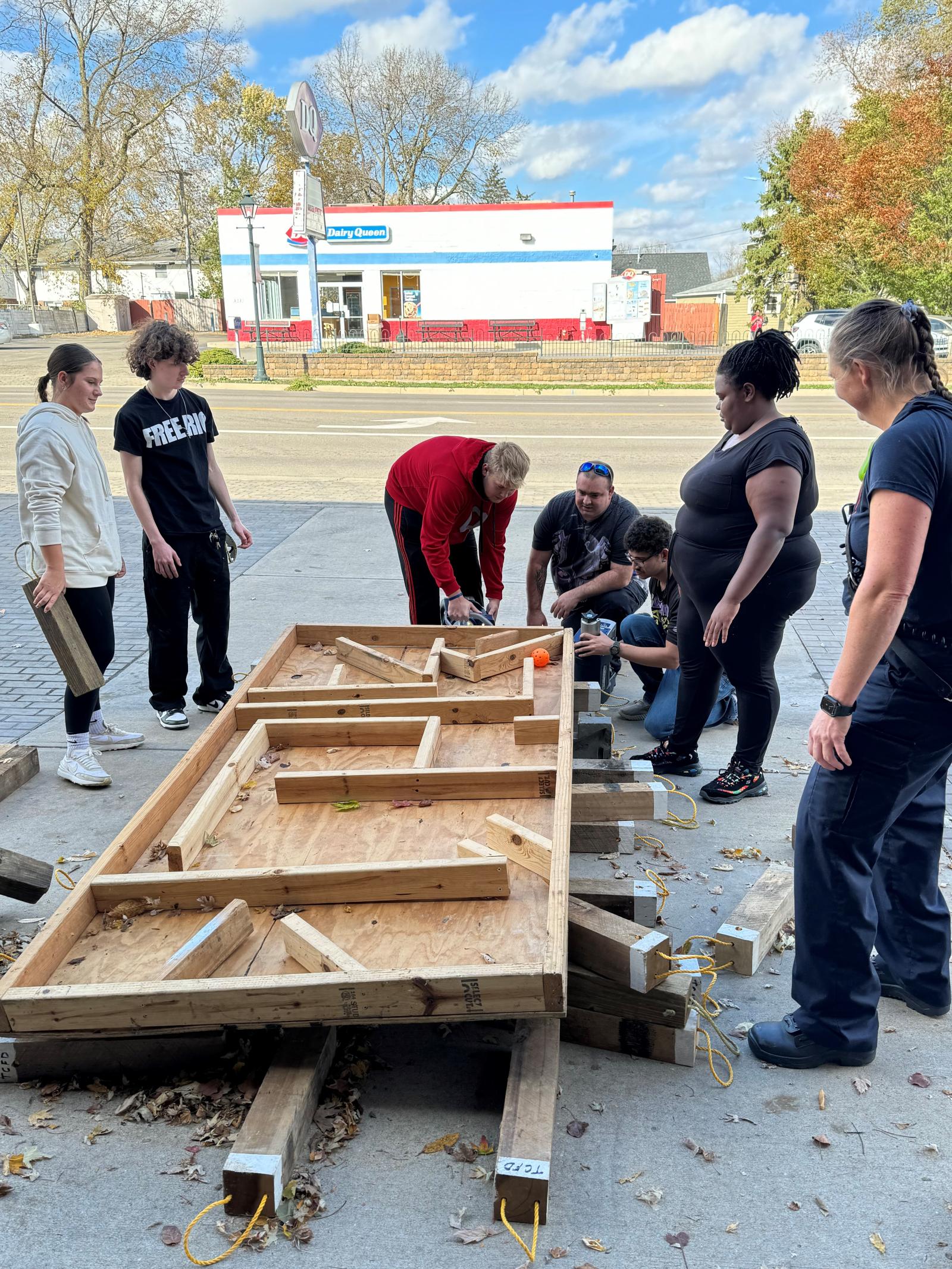 Students participate in a "game" at Tipp City Fire & EMS to see how they could work together using wedges and tools for extrication.