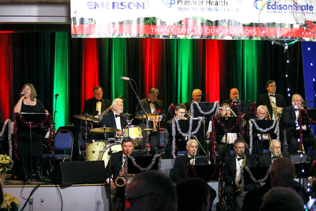Edison Foundation holiday evening event with a live band performing on stage