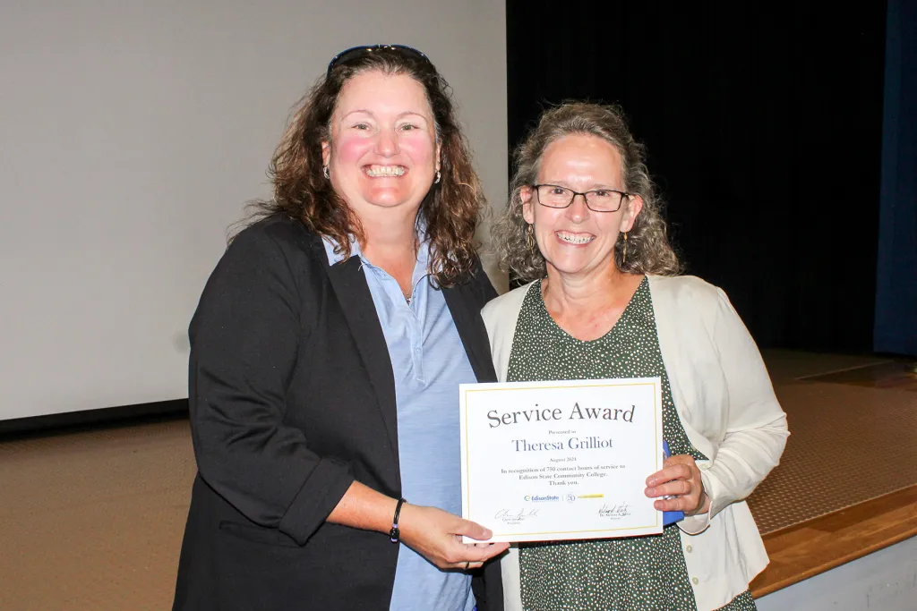Theresa Grilliot receives a gift for reaching 750 service hours in her career at Edison State