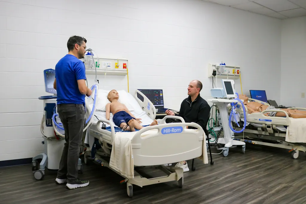 Drew Dukes and Zeke Wiechart showcase the impressive capabilities of the respiratory care manikins, highlighting their importance in training and education.