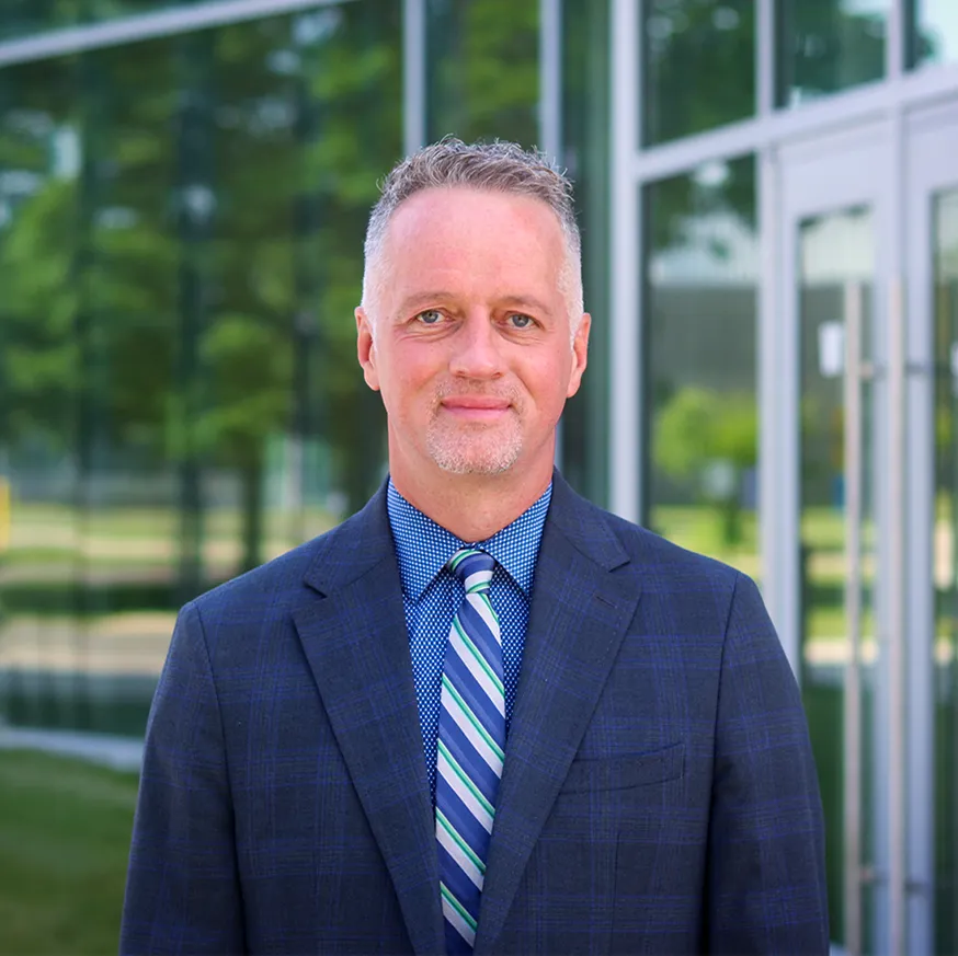 Chris Spradlin President outside building