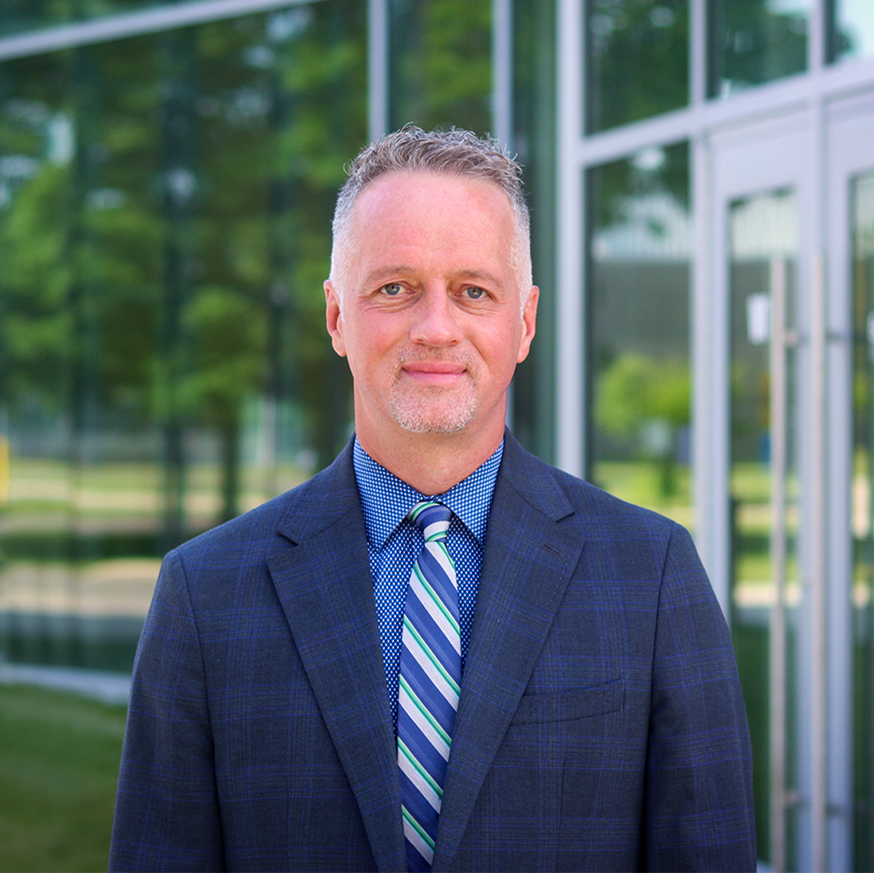 Chris Spradlin President outside building