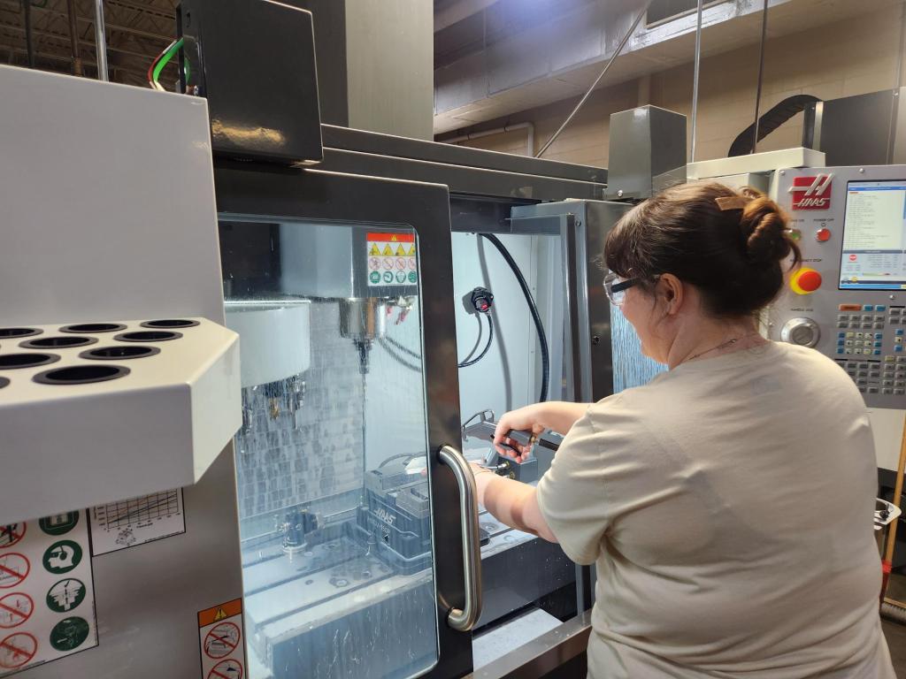 Collins Aerospace associate Alyssa Smith participates in a recent CNC milling lab as part of the Edison State Office of Workforce Development & Work-Based Learning’s CNC Tool Operator Training program. Edison State Industrial Technical Training Manager Daryl Curnutte led the lab.