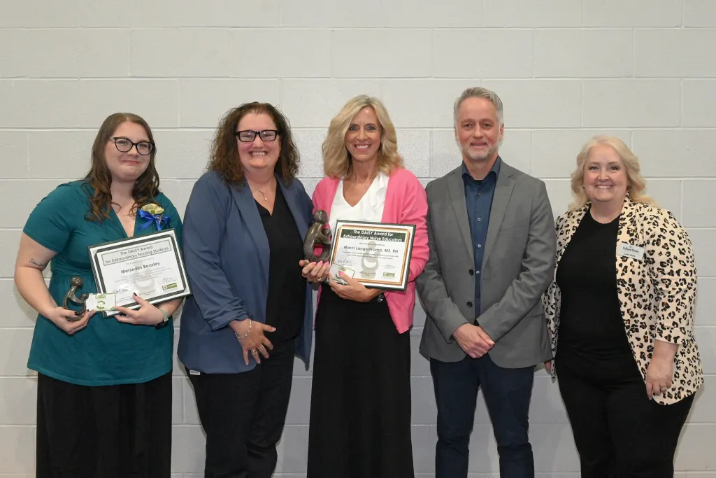 L to R: Mersedes Beasley; Dr. Melissa Wertz, Provost; Marci Langenkamp; Dr. Chris Spradlin, President; Leah Wells
