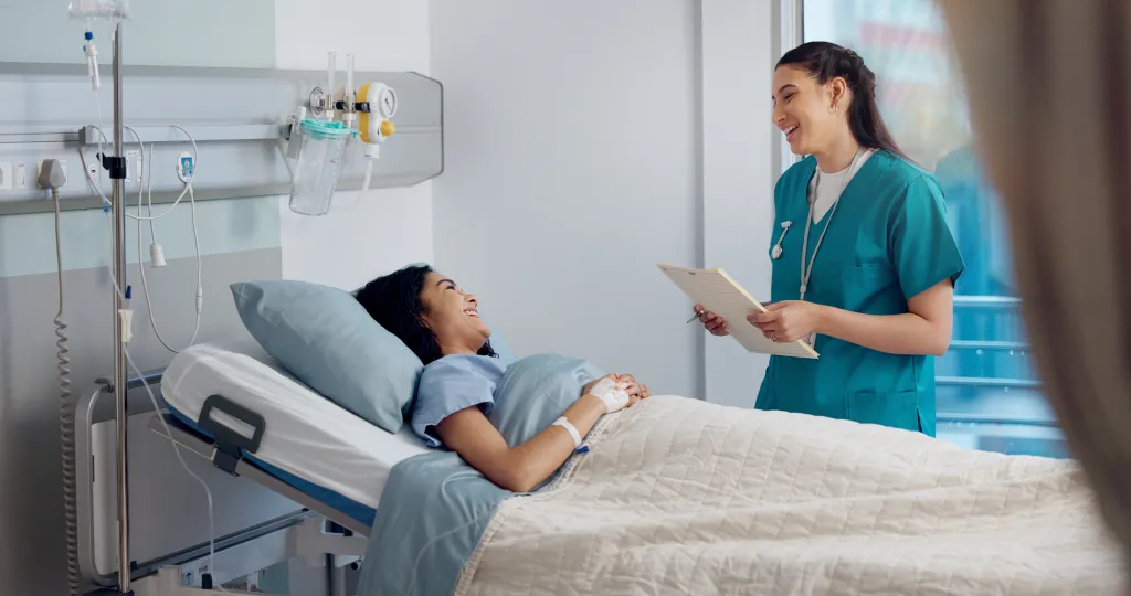 CNA interacting with a patent in a hospital setting