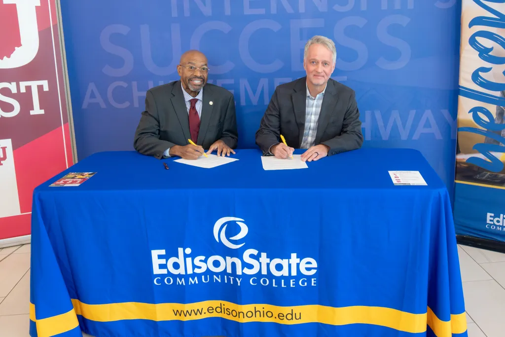 IU East Chancellor Dennis Rome (left) and Edison State President Dr. Chris Spradlin (right) sign a partnership agreement during an event held at Edison State on Monday, October 5, 2026.