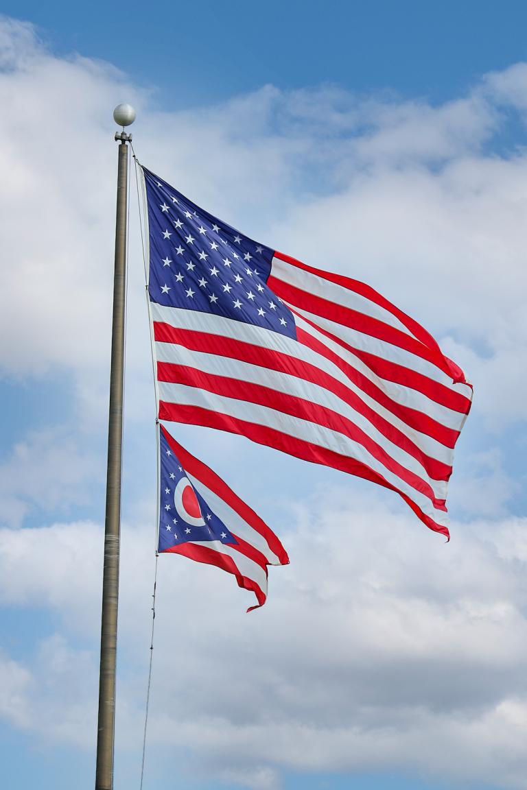 USA flag and Ohio flag blowing in the wind.