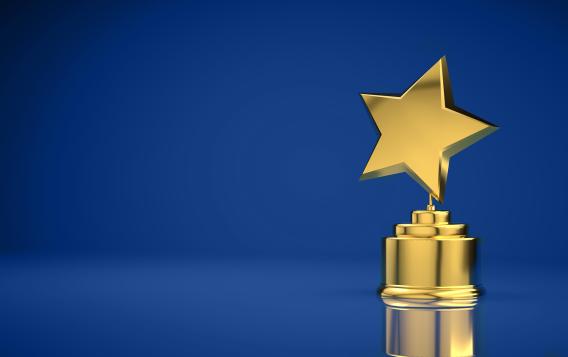Star trophy on blue background.