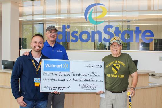 Walmart Store Manager Nathan Kelly presents grant check to Edison State representatives