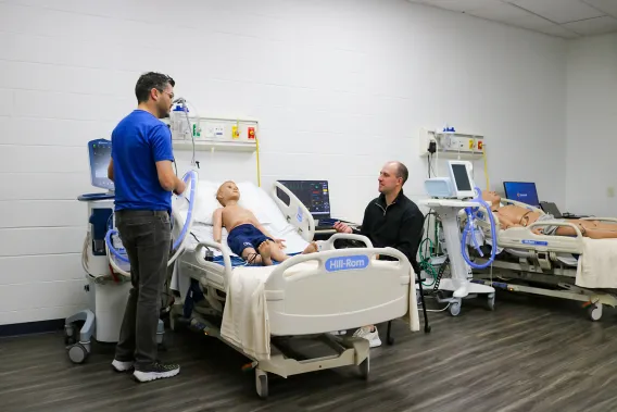 Drew Dukes and Zeke Wiechart showcase the impressive capabilities of the respiratory care manikins, highlighting their importance in training and education.