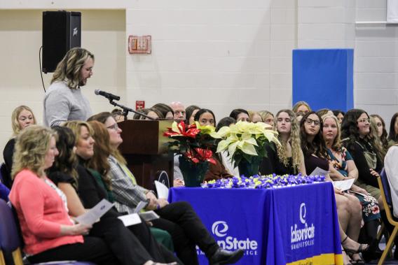 Guest speaker Dr. Dalton Blosser addresses recent nursing graduates during a pinning ceremony held in their honor.