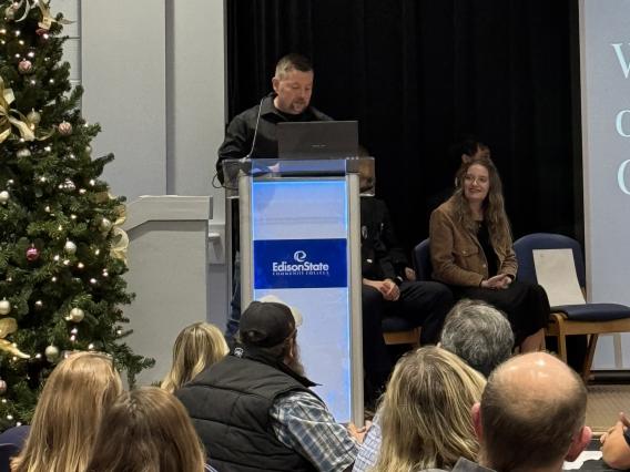 Guest speaker Paul J. Kimmel, Harrison Township Fire Department, speaks to recent paramedic graduates during a ceremony held in their honor.
