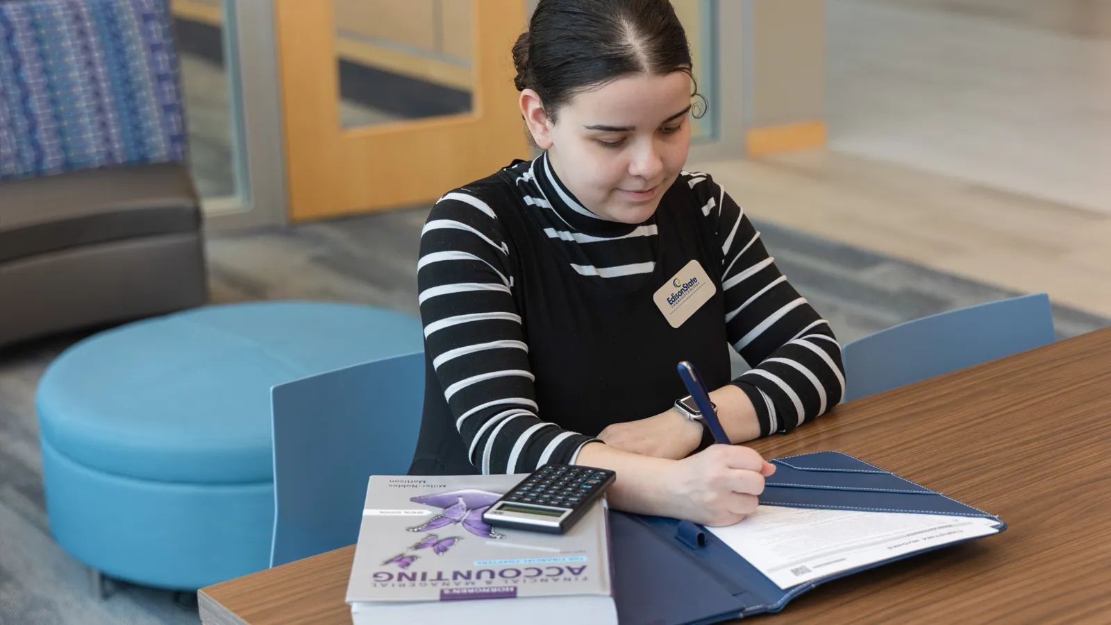 Accounting Student with a calculator